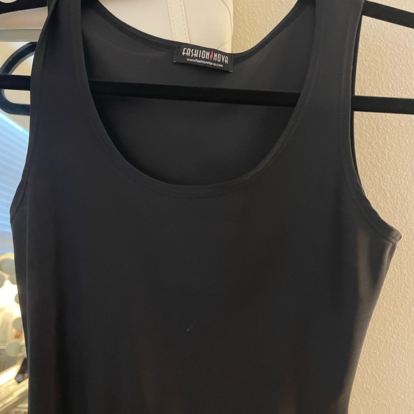 MAJOR CLOSET SALE. MORE ITEMS TO COME. 100% Lycra black mini dress. Very tight. - Picture 2 of 2